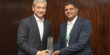 Krishna Sudheendra, CEO, UST Global recieving the award from Jean-Philippe Courtois, EVP and President - Global Sales, Marketing and Operations, Microsoft Corporation