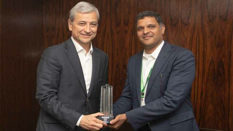 Krishna Sudheendra, CEO, UST Global recieving the award from Jean-Philippe Courtois, EVP and President - Global Sales, Marketing and Operations, Microsoft Corporation