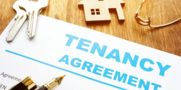 Tenancy agreement for rental lease and keys.