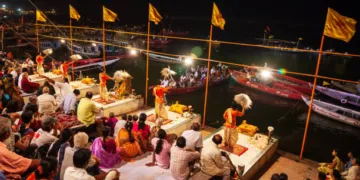 VARANASI, INDIA - APRIL 11, 2012: Ganga Aarti is a ceremony performed to honor the River Goddess Ganga at Dashaswamedh Ghat in Varanasi, India