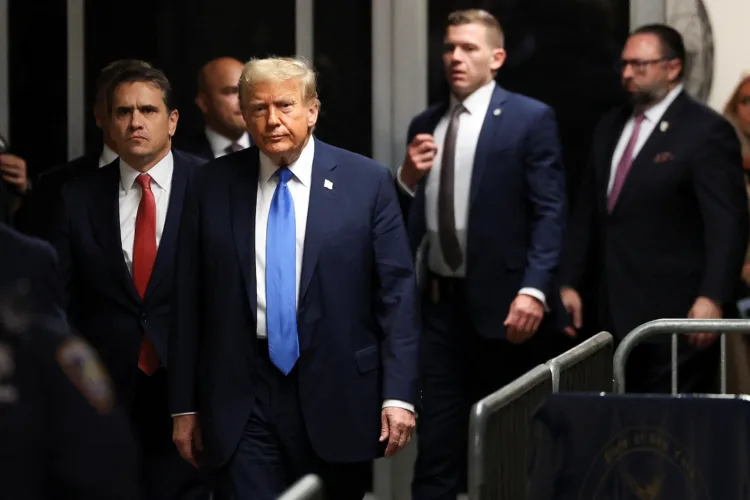 Former U.S. president and Republican presidential candidate Donald Trump arrives to attend his trial for allegedly covering up hush money payments linked to extramarital affairs at Manhattan Criminal Court in New York, U.S., April 22, 2024. Yuki Iwamura/Pool via REUTERS