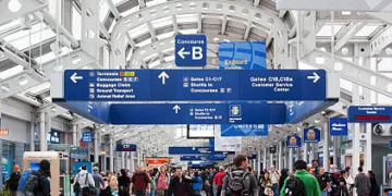 Chicago, USA - April 28, 2011: Passengers walking through Chicago O'Hare International Airport - also known as ORD.