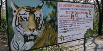 "Thekkady, India - March 25, 2006: Sign of Periyar Wildlife Park. Periyar National Park is a wildlife reseve located in Kerala, south India. The Nationalpark is located in the mountainous area of the Cardamon Hills near the border to the indian state of Tamil Nadu. The National Park is a protected reserve  for tigers , elephants and the nilgiri tar."