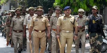 Noida, India- April 12, 2024: Noida Police along with Border Security Force (BSF) personnel during a flag march in the view of the upcoming Lok Sabha elections in sector 31, in Noida, India, on Friday, April 12, 2024. (Photo by Sunil Ghosh / Hindustan Times)