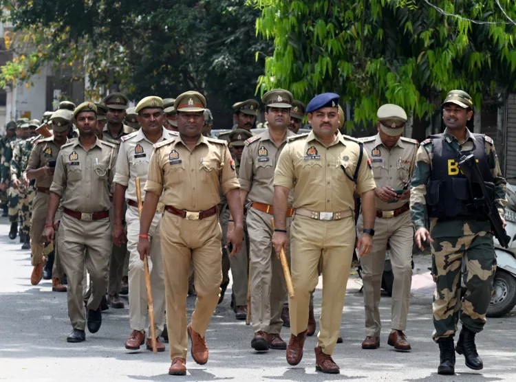 Noida, India- April 12, 2024: Noida Police along with Border Security Force (BSF) personnel during a flag march in the view of the upcoming Lok Sabha elections in sector 31, in Noida, India, on Friday, April 12, 2024. (Photo by Sunil Ghosh / Hindustan Times)