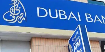 A logo stands outside Dubai Bank PJSC's Sheik Zayed Road branch in Dubai, United Arab Emirates, on Sunday, Oct. 16, 2011. Emirates NBD PJSC, the country's biggest lender by assets, said it will take over government-controlled Islamic lender Dubai Bank PJSC. Photographer: Duncan Chard/Bloomberg via Getty Images