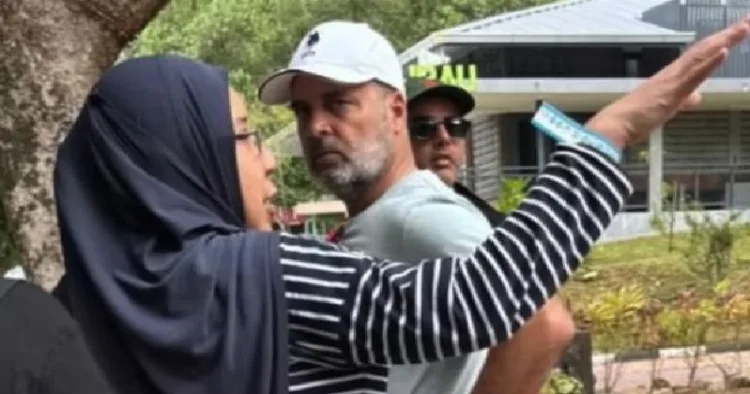 ബുള്ളറ്റില്‍ കയറി ബീഹാറില്‍ പ്രചാരണം നടത്തിയതിന്‍റെ ക്ഷീണം തീര്‍ക്കാന്‍ മലേഷ്യയില്‍ എത്തിയ രാഹുല്‍ ഗാന്ധി ഒരു മുസ്ലിം സ്ത്രീയുമായി സംസാരിക്കുന്നു (പപ്പരാസികള്‍ പുറത്തുവിട്ട ചിത്രം)