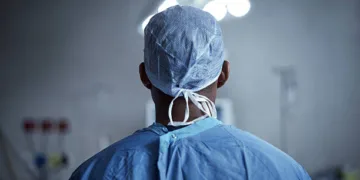 Rearview shot of a surgeon standing in an operating room