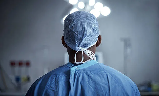 Rearview shot of a surgeon standing in an operating room