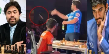 ഹികാരു നകാമുറ (ഇടത്ത്) ഗുകേഷ് (വലത്ത്) വിജയിച്ച ശേഷം ഗുകേഷിന്‍റെ കിംഗിനെ കാണികള്‍ക്ക് എറിഞ്ഞു കൊടുക്കുന്ന ഹികാരു (നടുവില്‍)