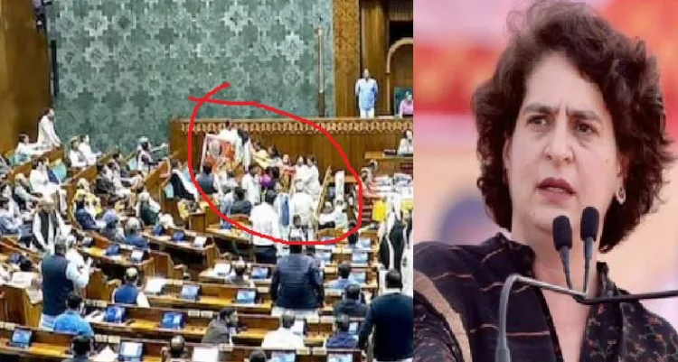 പാര്‍ലമെന്‍റില്‍ വനിത കോണ്‍ഗ്രസ് എംപിമാര്‍ പ്രധാനമന്ത്രി മോദിയുടേതുള്‍പ്പെടെ ഭരണപക്ഷഎംപിമാരുടെ കസേരകള്‍ വളയുന്നു (ഇടത്ത്)