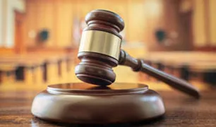 Judges gavel in court room legal trial and law background