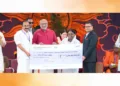 നേപ്പാളില്‍ മിന്നല്‍ പ്രളയം ദുരന്തം വിതച്ച മേഖലയിലെ ദുരിതാശ്വാസ പ്രവര്‍ത്തനങ്ങള്‍ക്കായി മാതാ അമൃതാനന്ദ-മയി മഠം നല്‍കുന്ന രണ്ട് കോടി രൂപ ഭാരതത്തിലെ നേപ്പാള്‍ അംബാസിഡര്‍ ഡോ. സുരേന്ദ്രഥാപയ്ക്ക് ഉപരാഷ്ട്രപതി സി.പി. രാധാകൃഷ്ണന്‍ കൈമാറുന്നു